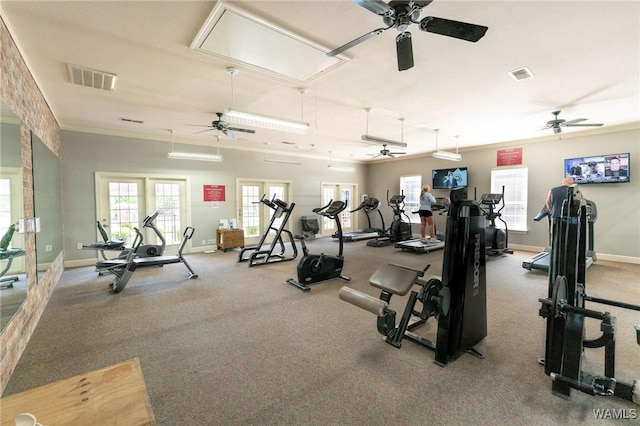 workout area with attic access, baseboards, a ceiling fan, and visible vents