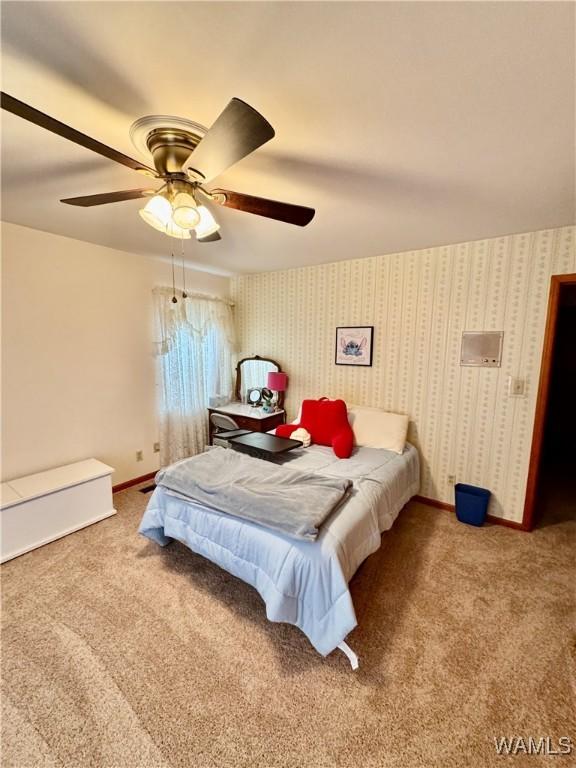 bedroom with ceiling fan and carpet floors