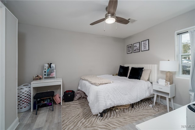 bedroom featuring ceiling fan and light hardwood / wood-style floors