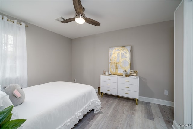 bedroom featuring ceiling fan and light hardwood / wood-style flooring