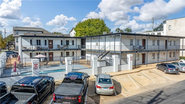 view of property featuring a community pool