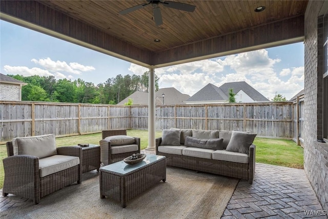 view of patio / terrace with a fenced backyard, a ceiling fan, and an outdoor hangout area