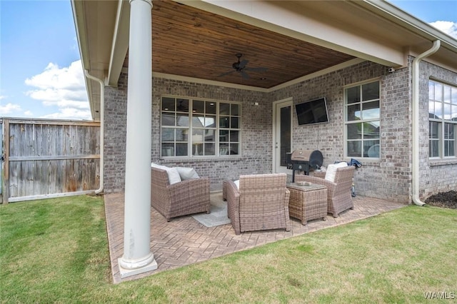view of patio / terrace featuring a ceiling fan, outdoor lounge area, and fence