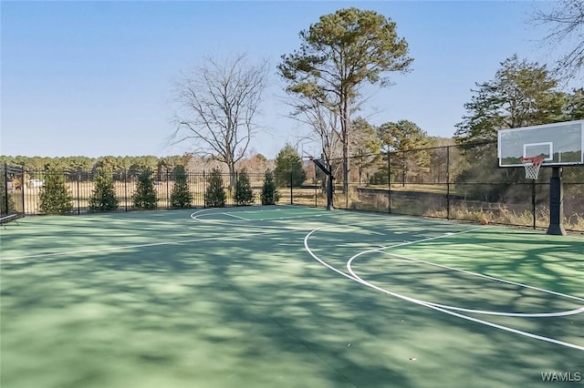 view of basketball court with fence and community basketball court