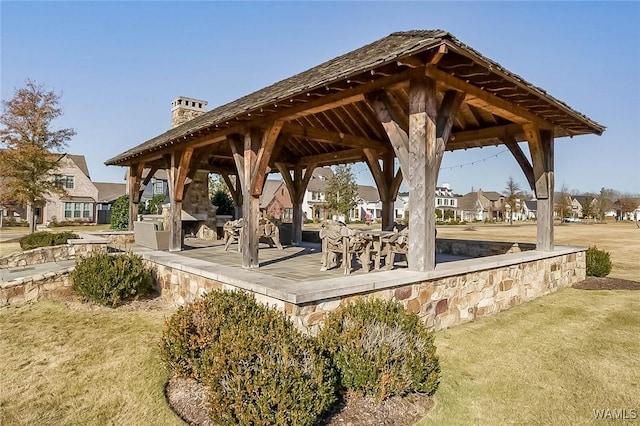 surrounding community with a gazebo, a yard, and a residential view
