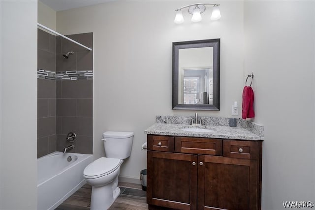 702 Gene Stallings Ave, Tuscaloosa, AL 35401 - bathroom with baseboards, toilet, shower / tub combination, wood finished floors, and vanity