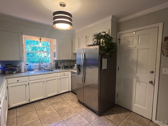 kitchen featuring stainless steel appliances, crown molding, sink, light tile patterned floors, and white cabinets