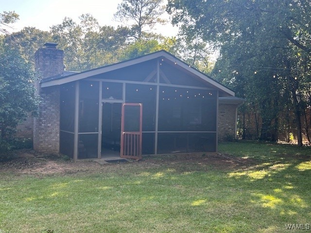 view of outdoor structure featuring a yard