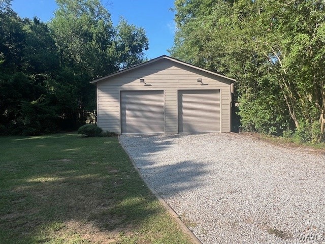 garage with a yard