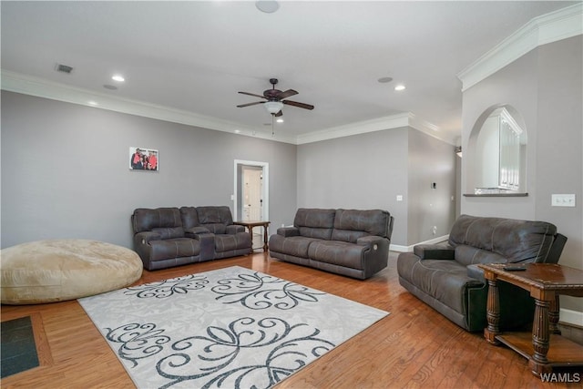 living room featuring recessed lighting, visible vents, crown molding, and wood finished floors