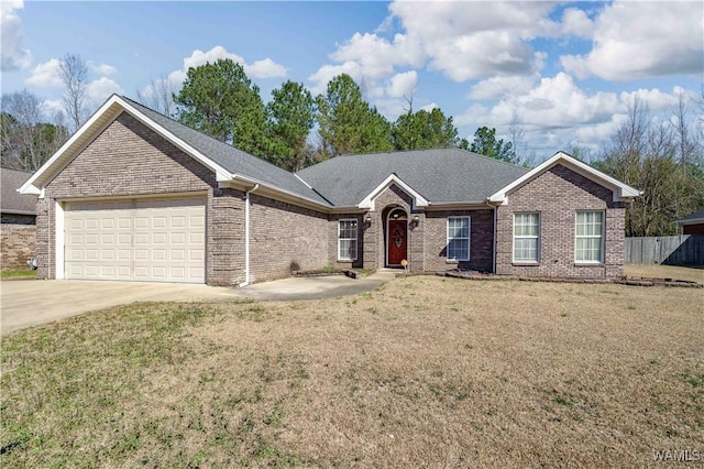 ranch-style home featuring a garage, concrete driveway, brick siding, and a front lawn