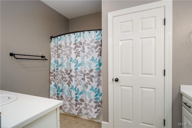 full bath featuring a shower with shower curtain, tile patterned flooring, and vanity