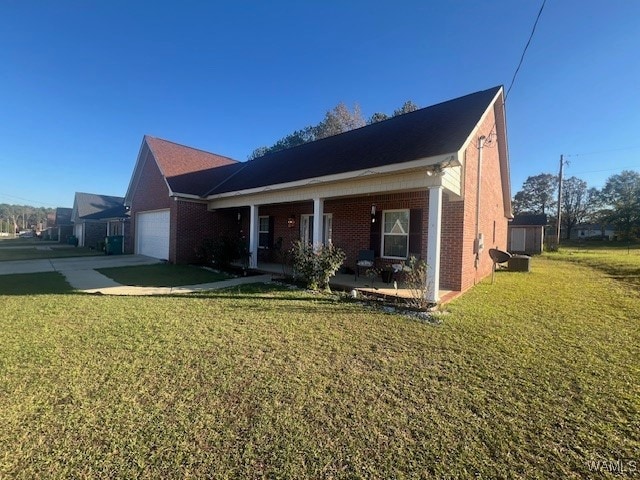 view of front of house with a porch, a garage, and a front yard