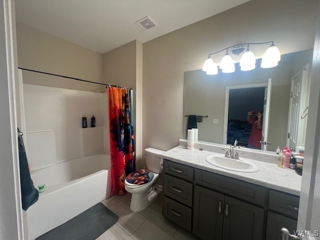 full bathroom with tile patterned flooring, vanity, shower / bath combo, and toilet