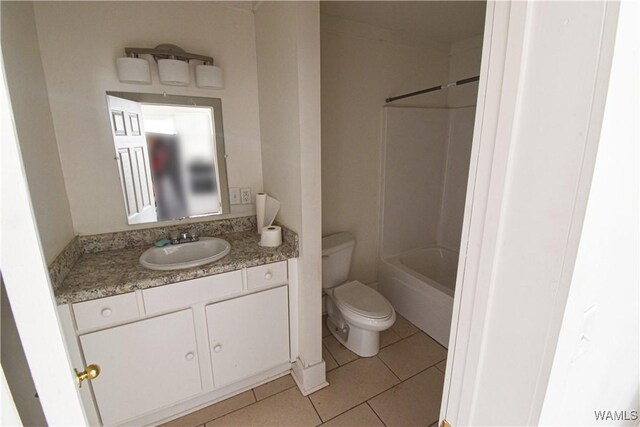 full bathroom with vanity, tub / shower combination, tile patterned floors, and toilet