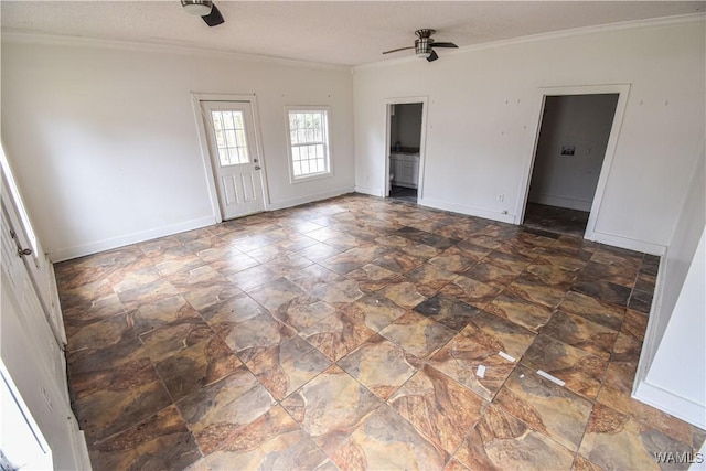 spare room featuring ceiling fan and ornamental molding