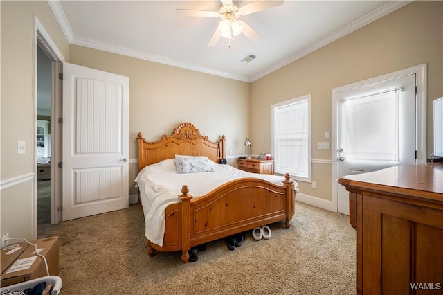 bedroom with carpet, ceiling fan, and crown molding