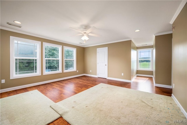 spare room with hardwood / wood-style floors, ceiling fan, and ornamental molding