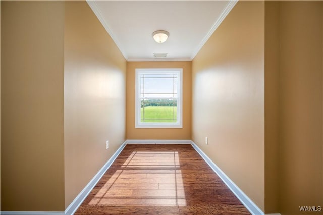 interior space with hardwood / wood-style floors and crown molding