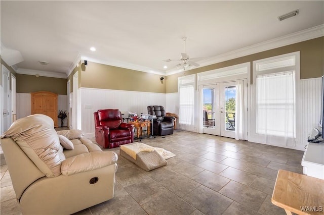 living room with crown molding, french doors, and ceiling fan