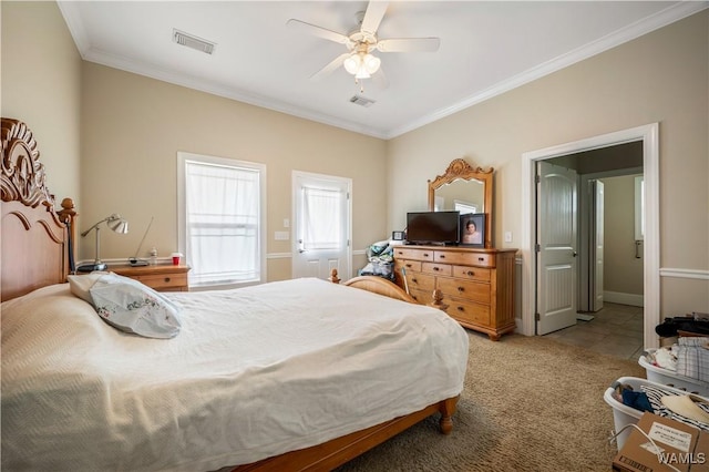 bedroom with ceiling fan, crown molding, and light colored carpet