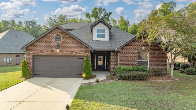 view of front of property with a garage, brick siding, driveway, roof with shingles, and a front yard