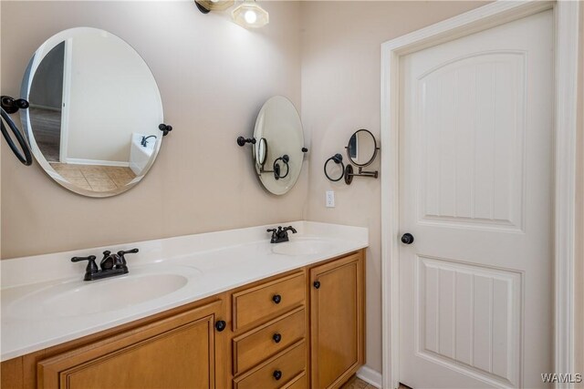 full bath with double vanity and a sink