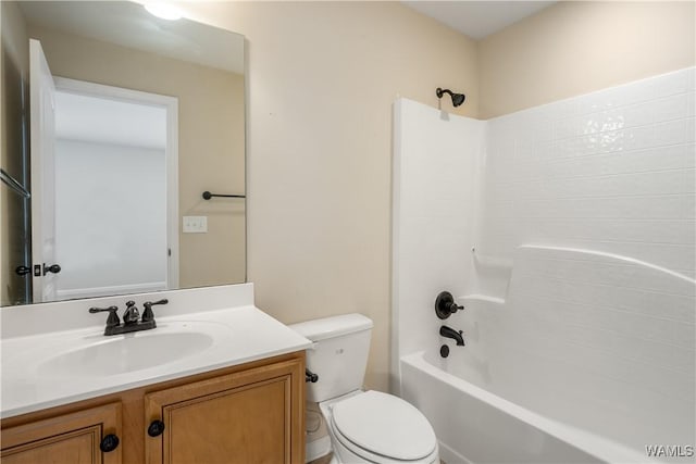 full bathroom featuring shower / washtub combination, vanity, and toilet