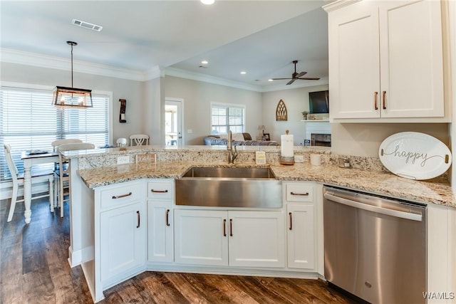 kitchen featuring sink, white cabinetry, dishwasher, ceiling fan, and pendant lighting