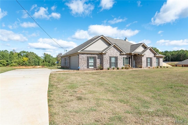 view of front of property with a front yard and a garage