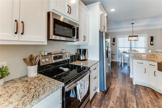 kitchen featuring light stone countertops, pendant lighting, dark hardwood / wood-style floors, stainless steel appliances, and white cabinets