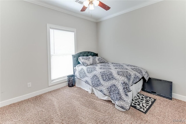 bedroom with ceiling fan, crown molding, and carpet flooring