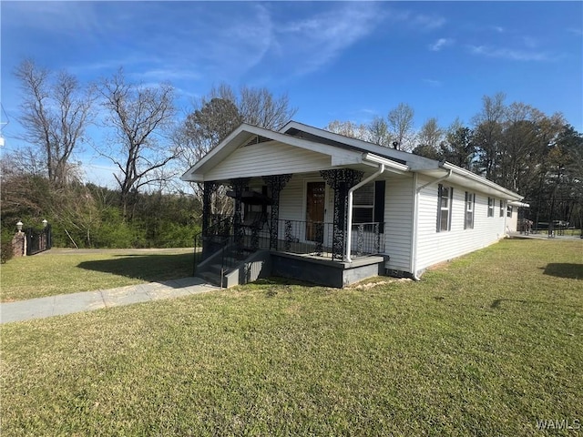 bungalow-style house featuring a front lawn and a porch