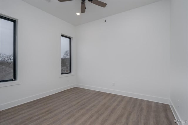 unfurnished room featuring hardwood / wood-style flooring and ceiling fan