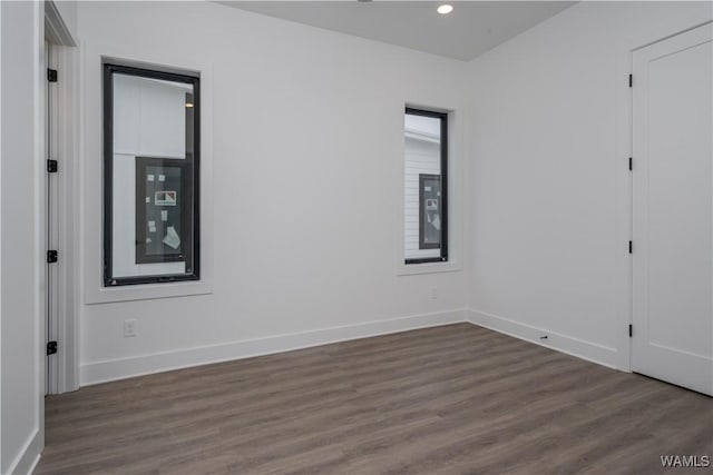 unfurnished bedroom with dark wood-type flooring