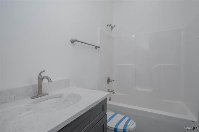 bathroom featuring shower / washtub combination and vanity