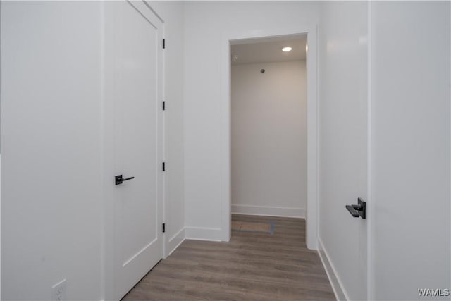 hallway with light hardwood / wood-style flooring