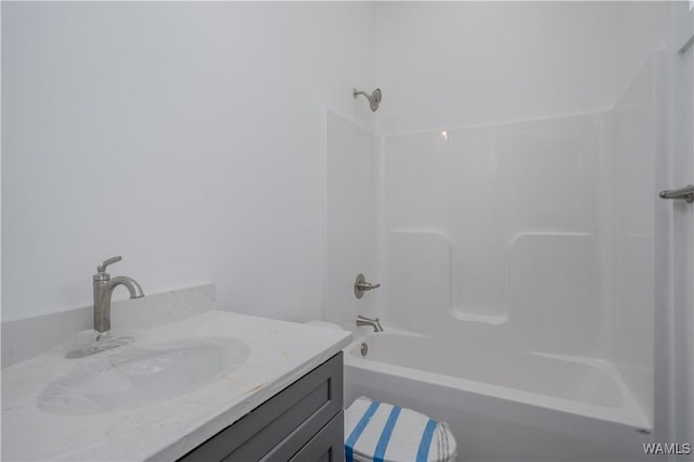 bathroom with bathing tub / shower combination and vanity