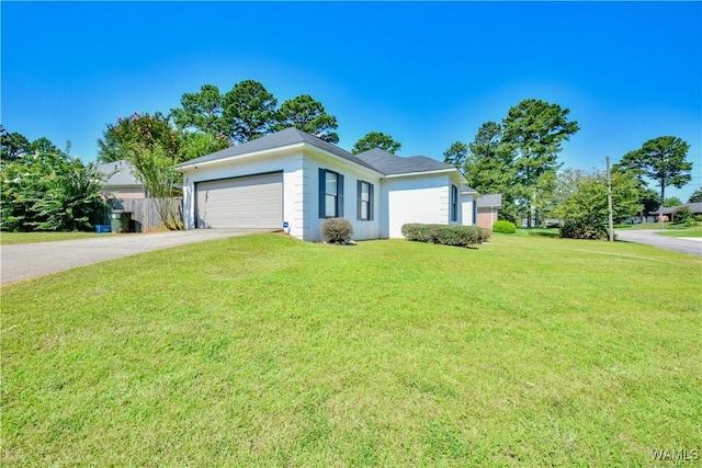 single story home with a garage and a front yard