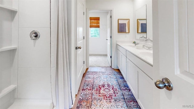 bathroom featuring vanity and wood-type flooring