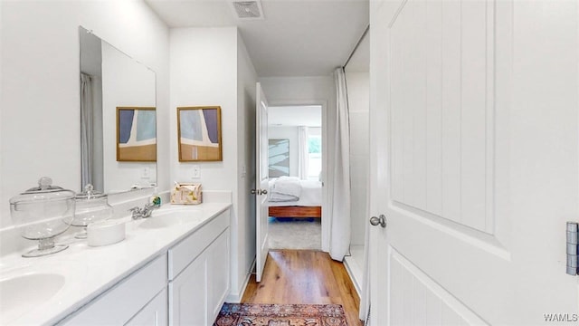 bathroom featuring vanity and hardwood / wood-style flooring