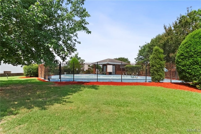 view of yard with a fenced in pool