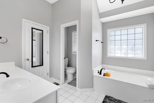 bathroom with a bathtub, tile patterned floors, toilet, and vanity