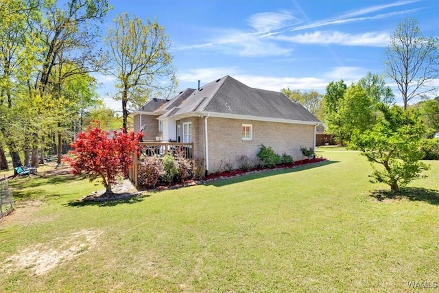 view of side of property with a yard