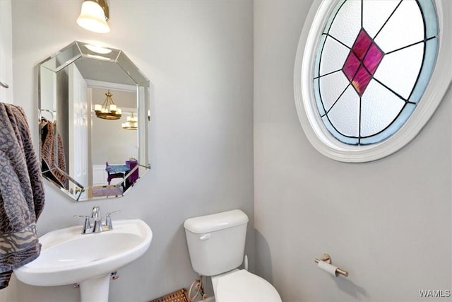 bathroom featuring sink and toilet