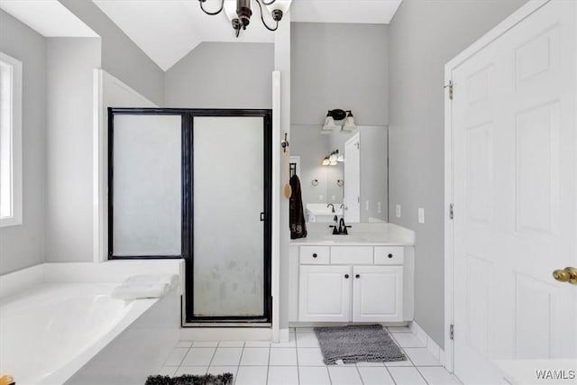 bathroom featuring an inviting chandelier, plus walk in shower, lofted ceiling, tile patterned floors, and vanity