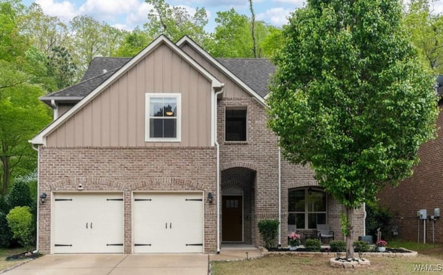 5432 Park Side Cir, Hoover, AL 35244 - view of front facade with board and batten siding, driveway, brick siding, and roof with shingles