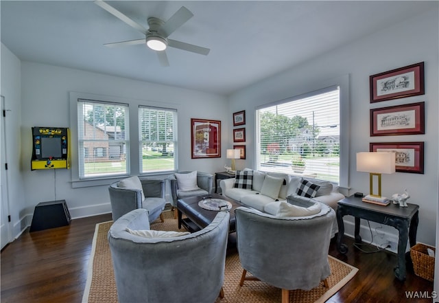 living room featuring ceiling fan and dark wood-type flooring