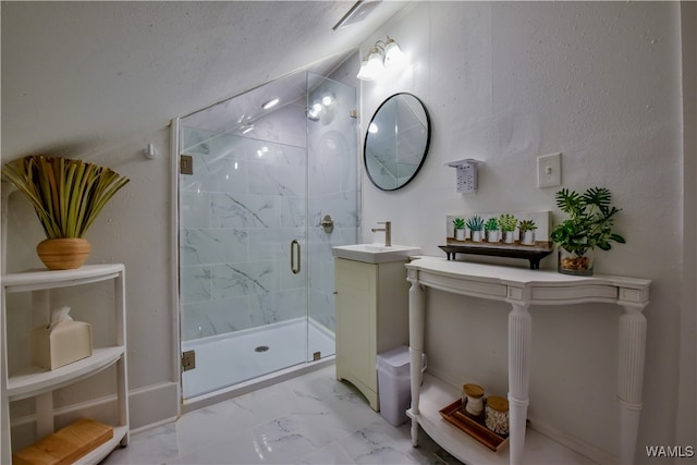 bathroom featuring an enclosed shower and sink