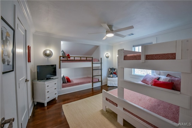 bedroom with ceiling fan, dark hardwood / wood-style flooring, and ornamental molding